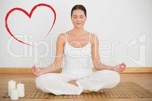 Composite image of smiling brunette sitting in lotus pose lookin
