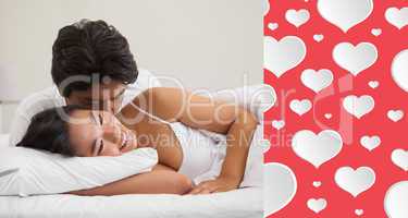 Composite image of couple lying in bed and cuddling