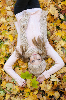 attractive young woman relaxing in atumn park outdoor