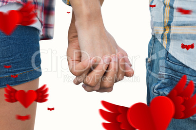 Composite image of couple in check shirts and denim holding hand