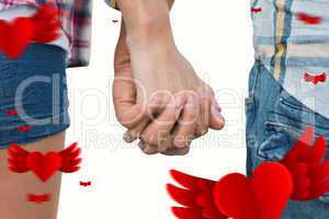 Composite image of couple in check shirts and denim holding hand