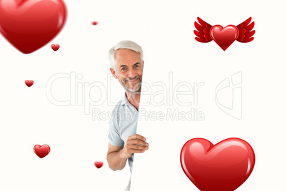 Composite image of smiling man showing large poster