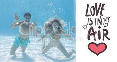 Composite image of cute couple smiling at camera underwater in t