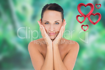 Composite image of beautiful nude brunette posing with hands on