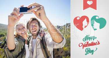 Composite image of hiking couple standing on mountain terrain ta