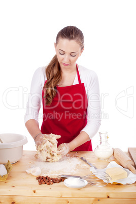 beautiful woman is baking cookies for christmas