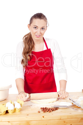 beautiful woman is baking cookies for christmas