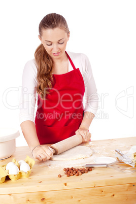 beautiful woman is baking cookies for christmas