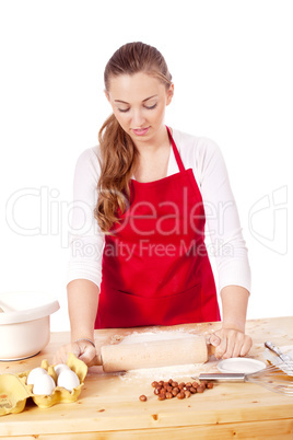 beautiful woman is baking cookies for christmas