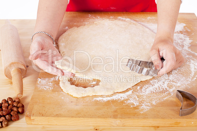 beautiful woman is baking cookies for christmas