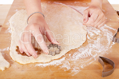 beautiful woman is baking cookies for christmas