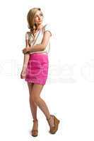 attractive young blonde woman with pink skirt isolated