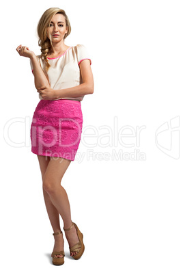 attractive young blonde woman with pink skirt isolated