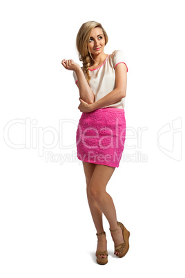 attractive young blonde woman with pink skirt isolated