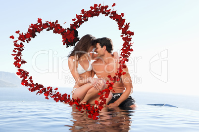 Composite image of couple on the pool edge