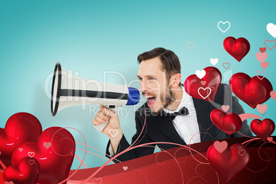 Composite image of geeky businessman shouting through megaphone