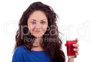 beautiful smiling brunette woman is drinking red juice