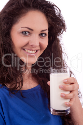 beautiful smiling woman is drinking milk