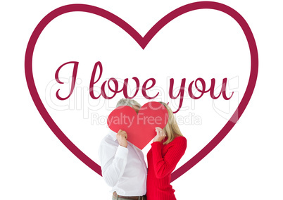 Composite image of couple embracing and holding heart over faces