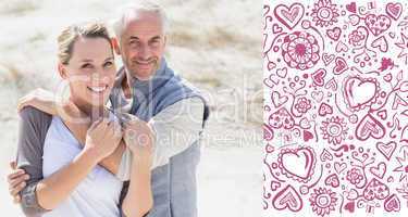 Composite image of happy hugging couple on the beach looking at