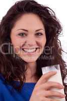 beautiful smiling woman is drinking milk