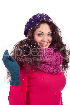 beautiful smiling brunette woman in snow in winter