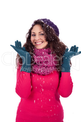 beautiful smiling brunette woman in snow in winter