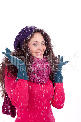 beautiful smiling brunette woman in snow in winter