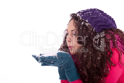 beautiful smiling brunette woman in snow in winter