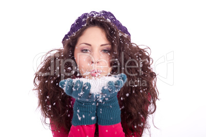 beautiful smiling brunette woman in snow in winter