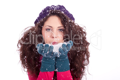 beautiful smiling brunette woman in snow in winter