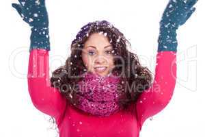 beautiful smiling brunette woman in snow in winter