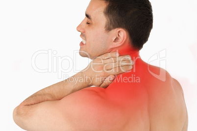 Young man suffering from neck pain