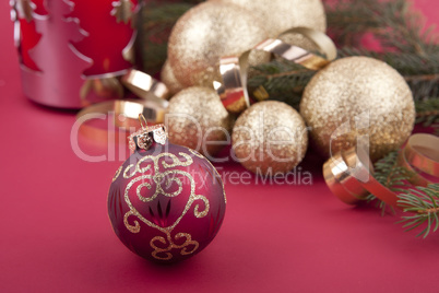 beautiful golden christmas decoration on red background