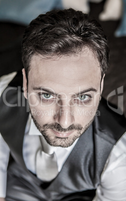 Portrait of young Italian groom with dragan effect