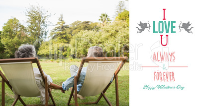 Composite image of happy mature couple sitting in park