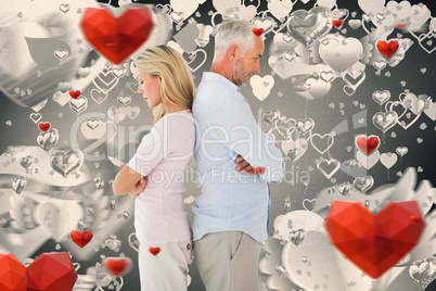 Composite image of unhappy couple not speaking to each other