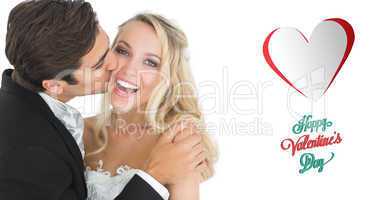 Composite image of handsome bridegroom kissing his wife on her c