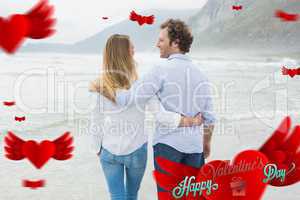 Composite image of rear view of a romantic couple at beach