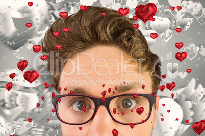 Composite image of geeky businessman looking at camera