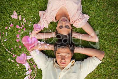 Composite image of woman and a man lying head to head with both