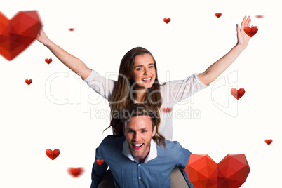 Composite image of smiling young man carrying woman Composite image of smiling young man carrying woman