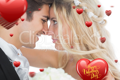 Composite image of happy young married couple looking each other