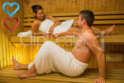 Composite image of calm couple relaxing in a sauna and chatting