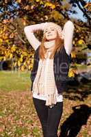young woman in autumn sunshine outdoor