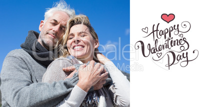 Composite image of carefree couple hugging in warm clothing Composite image of carefree couple hugging in warm clothing