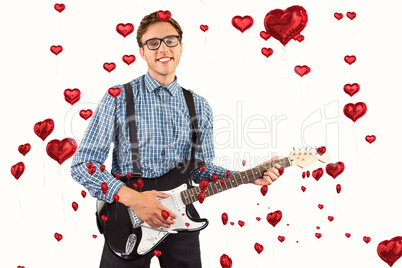 Composite image of geeky hipster playing the guitar