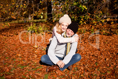 happy young couple smilin in autumn outdoor