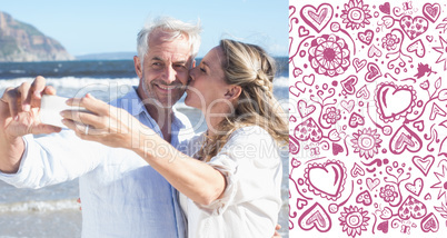 Composite image of married couple at the beach together taking a