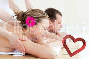 Composite image of relaxed couple having a back massage